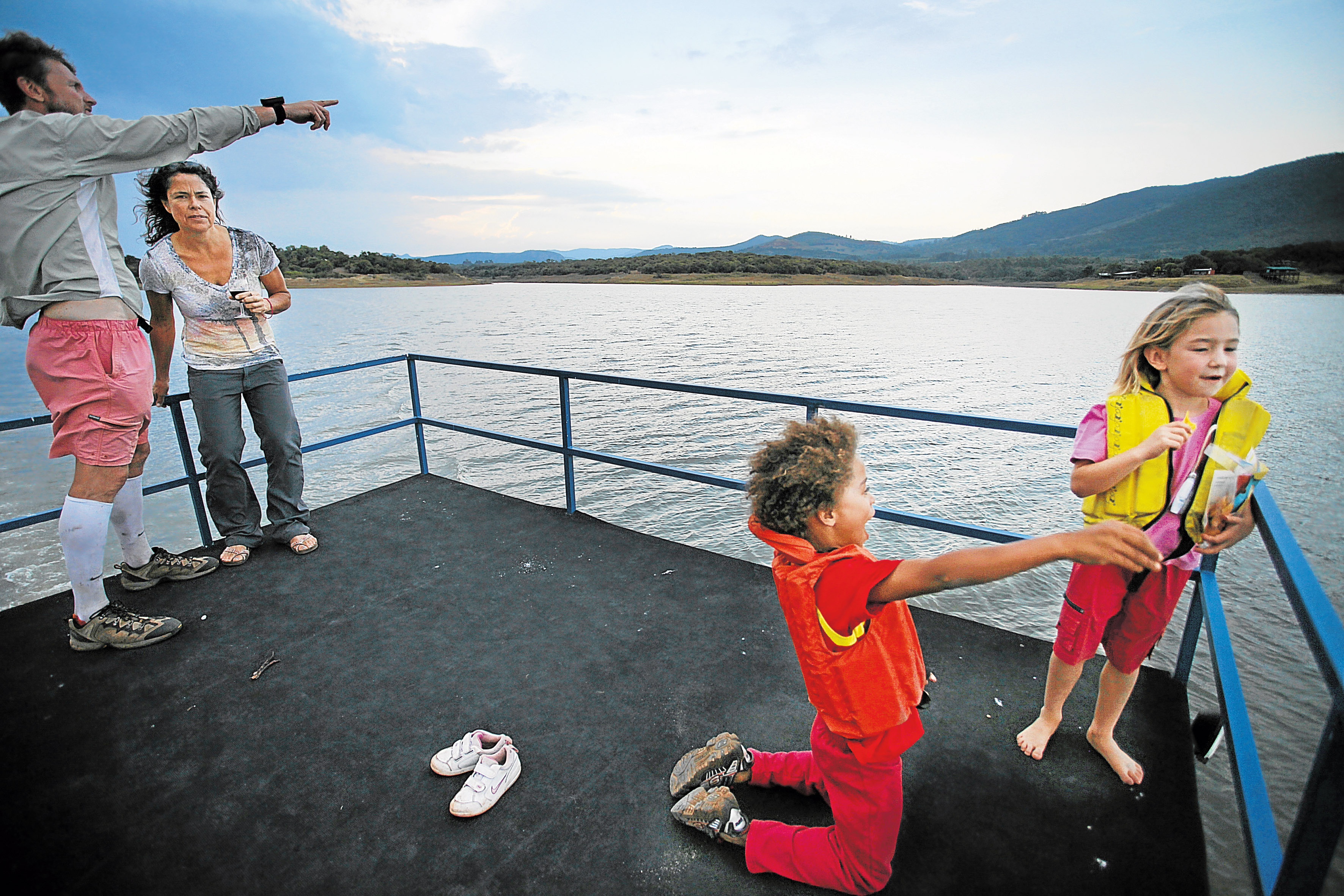 LIMPOPO, SOUTH AFRICA - JUNE 17: A man and woman with their children take a boat ride on the Albasini dam on June 17, 2012 in Limpopo, South Africa. Feature text available. (Photo by Gallo Images / Sunday Times / Marianne Schwankhart) *** Local Caption ***