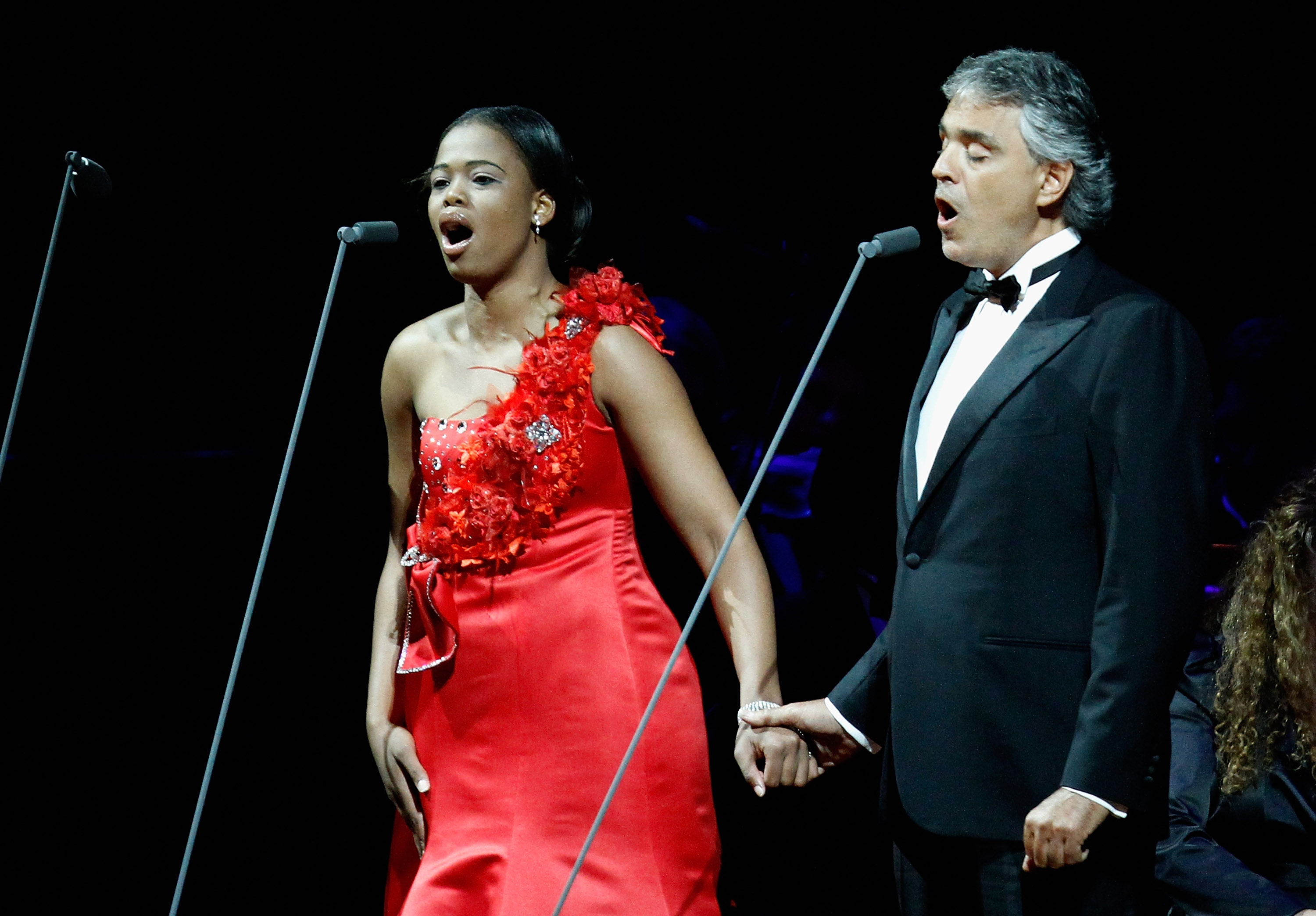 JOHANNESBURG, SOUTH AFRICA - JULY 09: South African soprano Pretty Yende and tenor Andrea Bocelli perform on stage during the Celebrate Africa The Grand Finale at the Coca Cola Dome on July 9, 2010 in Johannesburg, South Africa. (Photo by Michelly Rall/Getty Images)