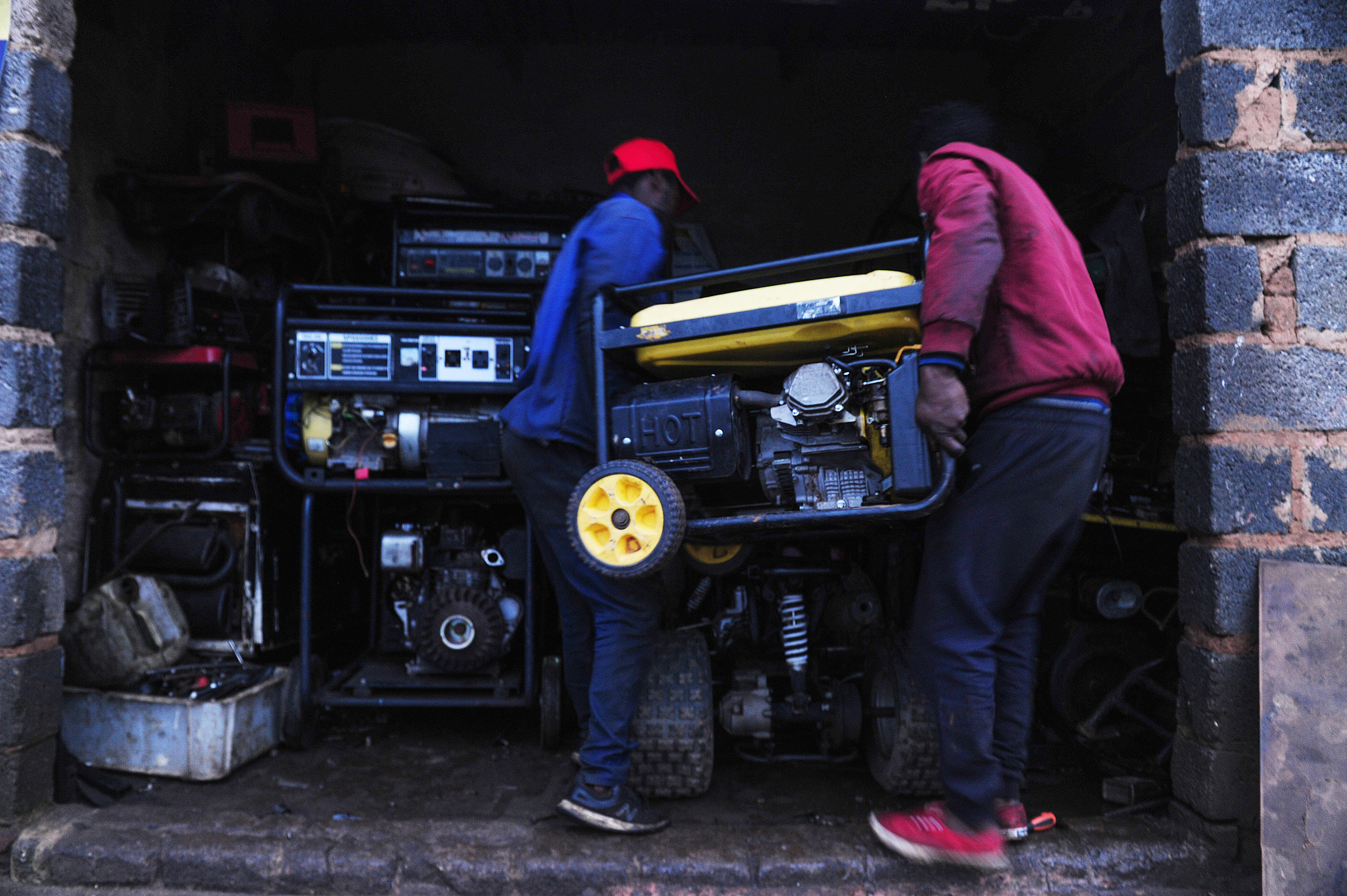 Employees at a generator repair business in Soweto.