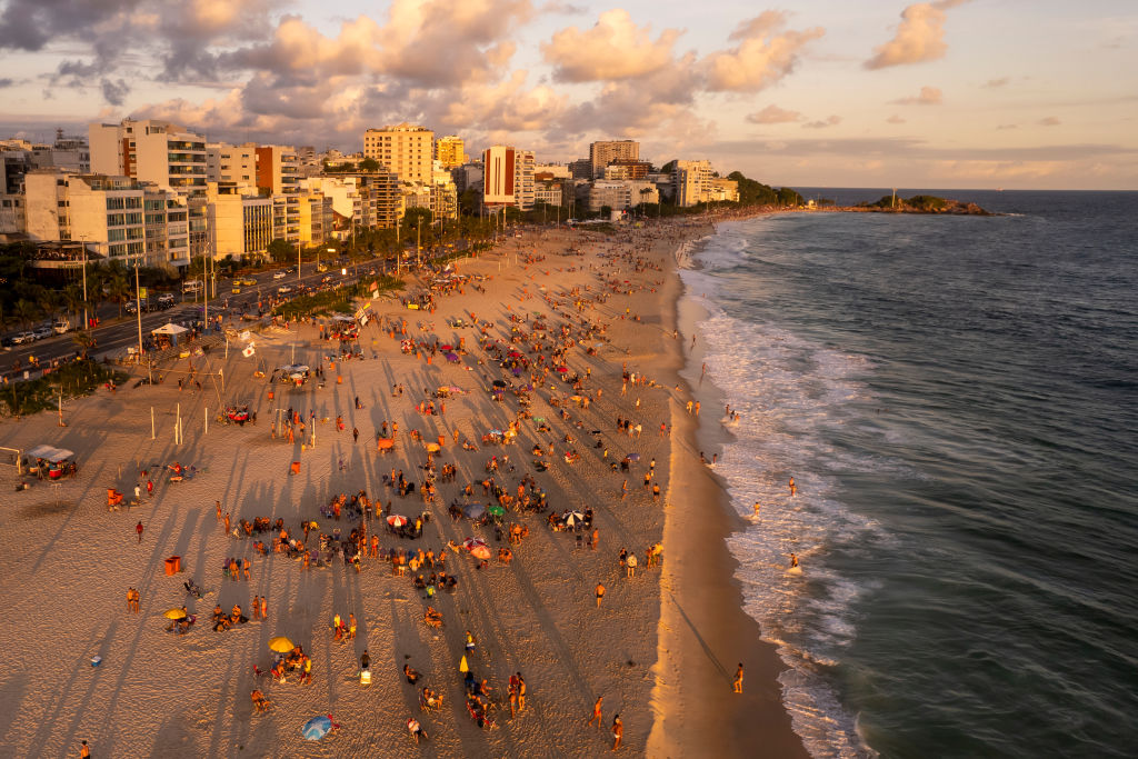 RIO DE JANEIRO, BRAZIL - JANUARY 26: In an aerial view, Tourists and locals enjoy the sunset during the summer at the famous Ipanema beach on January 26, 2023 in Rio de Janeiro, Brazil. (Photo by Buda Mendes/Getty Images)