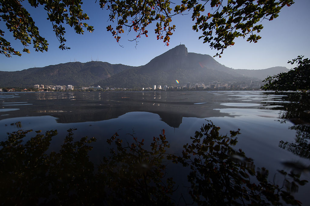 RIO DE JANEIRO, BRAZIL - JULY 05: General view of the Rodrigo de Freitas Lagoon with the Christ the Redeemer in background on July 5, 2016 in Rio de Janeiro, Brazil. The city of Rio de Janeiro already breathes the atmosphere of the Olympic Games, within 30 days to beginning. Rio 2016 will be the first Olympic Games in South America. The event will take place between 5 to 21 August. (Photo by Buda Mendes/Getty Images)