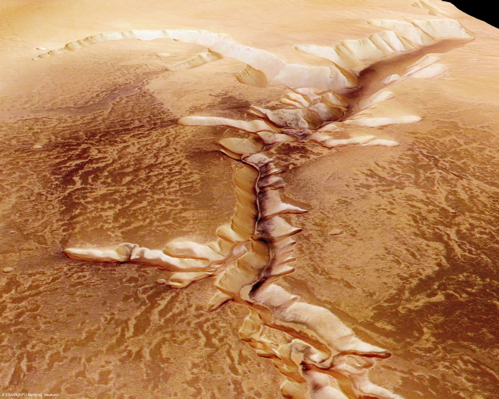 In this handout image supplied by the European Space Agency (ESA) on July 16, 2008, The Echus Chasma, one of the largest water source regions on Mars, is pictured from ESA's Mars Express. The data was acquired on September 25, 2005. The dark material shows a network of light-coloured, incised valleys that look similar to drainage networks known on Earth. It is still debated whether the valleys originate from precipitation, groundwater springs or liquid or magma flows on the surface. Image: ESA via Getty Images