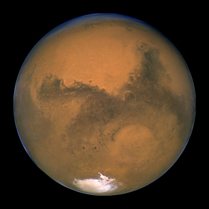 NASA/ESA Hubble Space Telescope snapped this portrait of Mars within minutes of the planet's closest approach to Earth in nearly 60,000 years. This image was made from a series of exposures taken between 5:35 a.m. and 6:20 a.m. EDT Aug. 27 with Hubble's Wide Field and Planetary Camera 2. In this picture, the red planet is 34,647,420 miles (55,757,930 km) from Earth. This sharp, natural-color view of Mars reveals several prominent Martian features, including the largest volcano in the solar system, Olympus Mons; a system of canyons called Valles Marineris; an immense dark marking called Solis Lacus; and the southern polar ice cap. Image: NASA/ESA, J. Bell (Cornell U.) and M. Wolff (SSI)