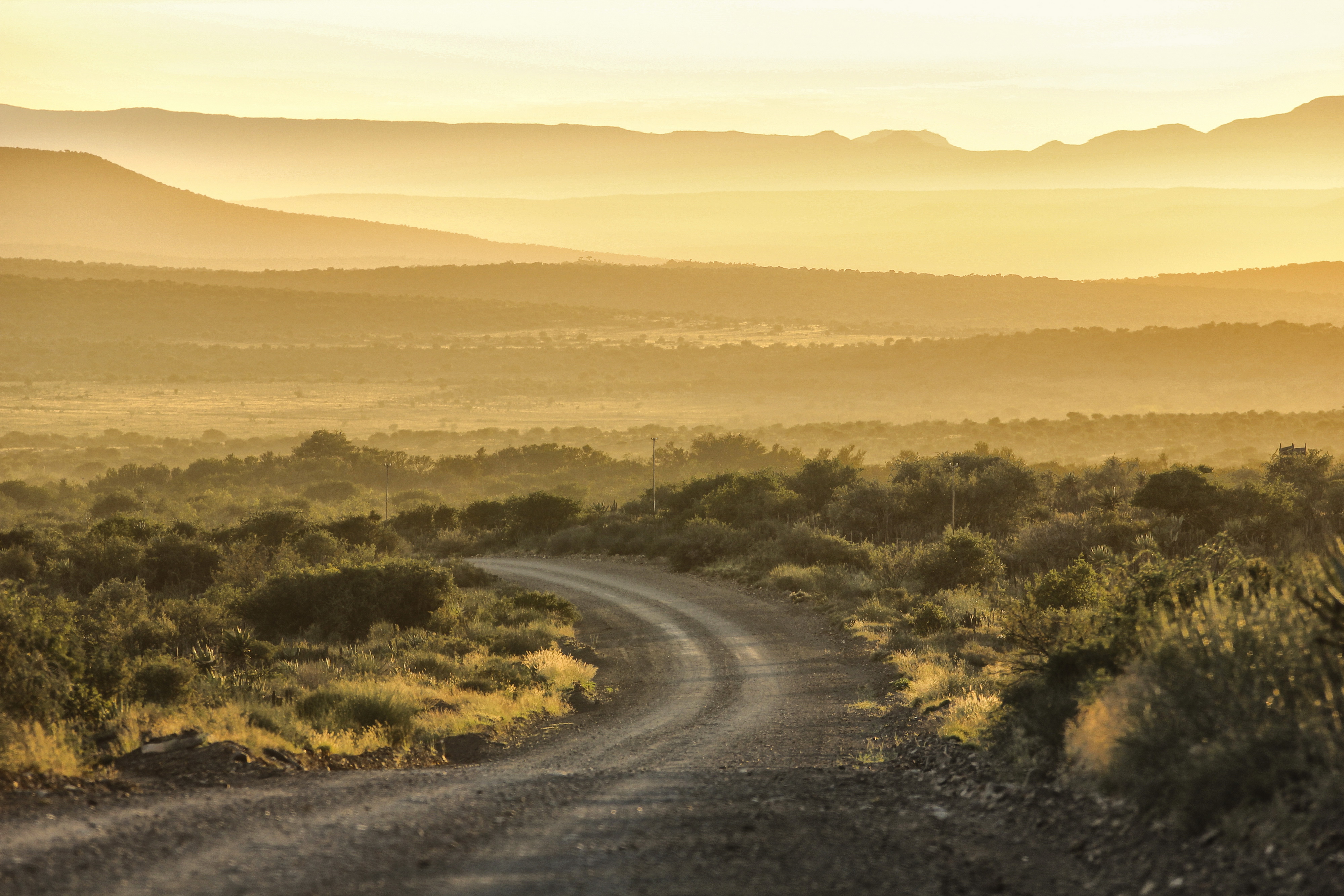 Sunset on a dusty Karoo road outside Jansenville. Image: Chris Marais
