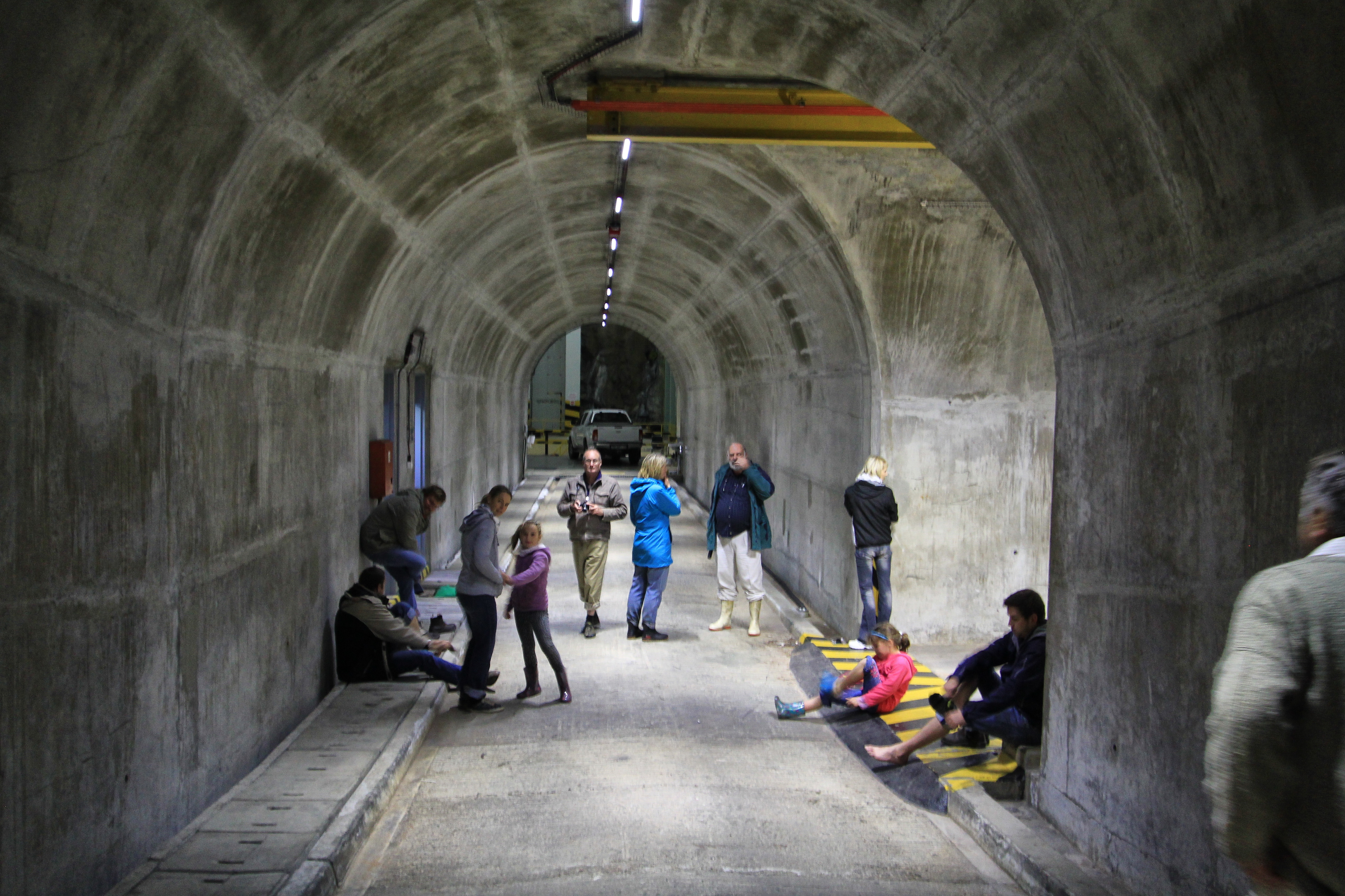 A small group of visitors, about the enter the dark, damp tunnels below. Image: Chris Marais