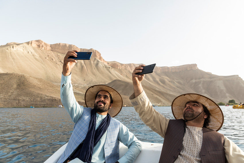 Two young tourists from Kabul take a selfie during a boat trip on Lake Bandi Amir in Bamyan province. Because of the very long war, for many people this is the first time they have been able to travel outside their city. Central Asia was once traversed by numerous peoples, traders and armies. Afghanistan was at the heart of this world, as it welcomed those who travelled across Asia, yet arguably none of the invaders ever completely left. These images document a journey through Afghanistan after 40 years of war and four years of drought. © Bruno Zanzottera, Italy, Finalist, Professional competition, Landscape, Sony World Photography Awards 2023