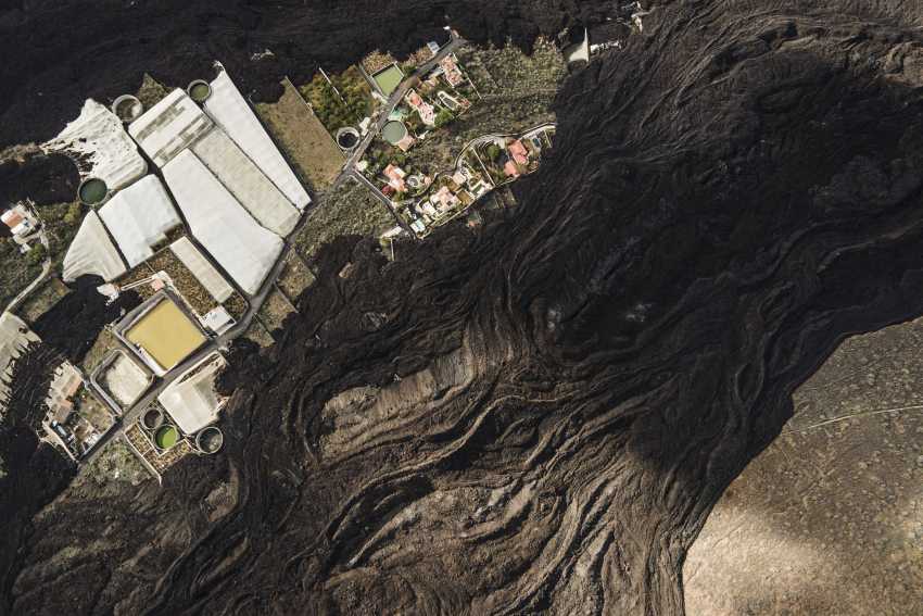 An aerial view of the lava flows from the volcano. La Palma, Spain, 22 January 2022. This volcanic eruption on the island of La Palma in the Canary Islands started on 19 September 2021 and lasted for 85 days, destroying thousands of homes and displacing more than 10,000 people in the process. It also covered large areas with ash, which now accumulates everywhere. One of the areas most affected by the ash was the town of Las Manchas, where several meters of ash completely buried many homes. For an assignment I documented the reality of the island and the transformation of its territory one month after the end of the volcano’s eruption. © Cesar Dezfuli, Spain, Shortlist, Professional competition, Landscape, Sony World Photography Awards 2023