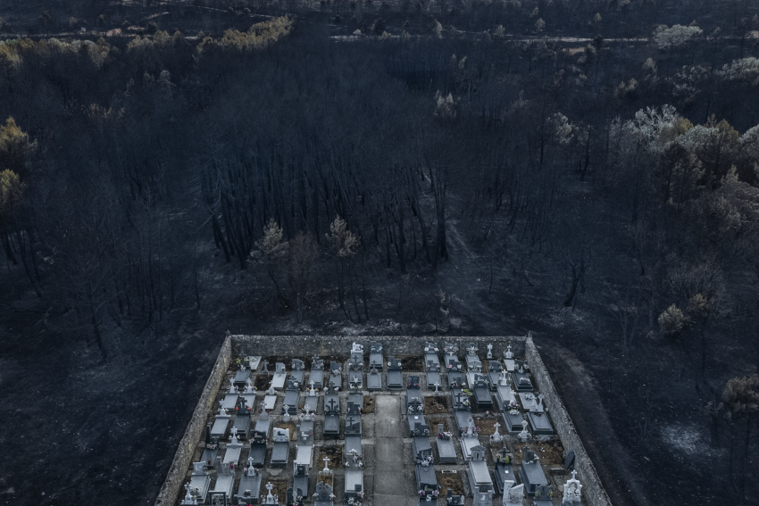 "Burned Landscape". A view of the cemetery in the town of Otero de Bodas in Zamora. In 2022, the region experienced one of the most devastating forest fires in the history of Spain, when 28,046 hectares burned in Sierra de la Culebra. Between 2012 and 2022 the number of large wildfires in Spain, where 500 hectares or more have been burned, has increased by more than 10 percent compared to the previous decade. Devouring everything in their path, these are extreme events that are impossible for firefighting teams to deal with. The scientific community links them directly to climate change and qualifies them as sixth generation fires. The risk is great, with catastrophic damage to the landscape, the economy and the lives of the population. This series of aerial images shows the consequences of the forest fires in Spain in the summer of 2022. © Brais Lorenzo Couto, Spain, Shortlist, Professional competition, Landscape, Sony World Photography Awards 2023