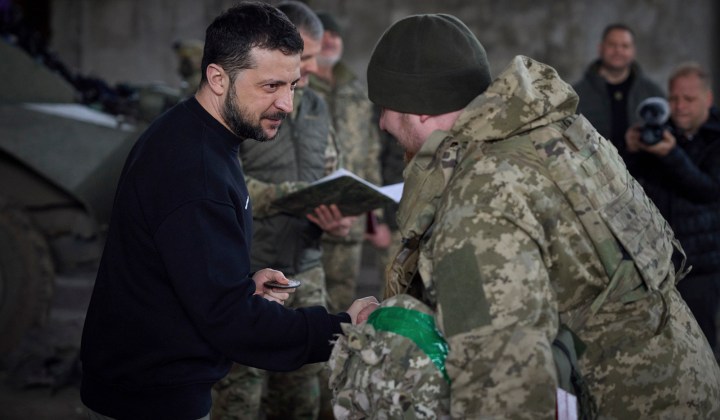 Zelensky visits troops near besieged Bakhmut; Russia says its gold stash grew during war