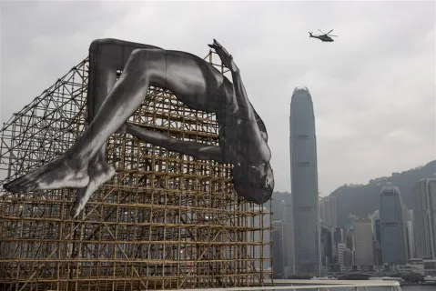 In images: Installation of a larger-than-life high jumper floating in mid-air in Hong Kong