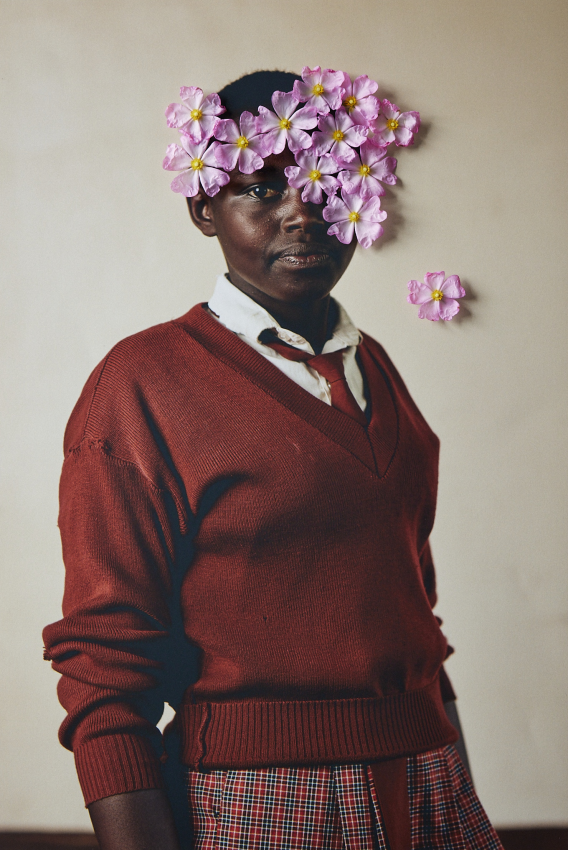 "Purity Ntetia Lopores". Portrait of Purity Ntetia Lopores, 14, a student at Kakenya’s Dream school, who says: ‘I love art and would love to pursue music in the future.’ The flowers are used to create a playful world where girls are shown exuding pride and joy and in this way the flowers are also used to reclaim their futures and dreams and to re-imagine the narrative of child marriage. What do girls dream of? And what happens when a supportive environment is created where girls are empowered and given the opportunity to learn and dream? The Right to Play creates a playful world where girls are shown in an empowered and affirming way. Worldwide, it is estimated that around 129 million girls are out of school and only 49 percent of countries have achieved gender parity in primary education, with the gap widening at secondary school level. Every day, girls face barriers to education caused by poverty, cultural norms and practices such as FGM, poor infrastructure and violence. For this project, I worked with girls from Kakenya’s Dream in Enoosaen, Kenya who have avoided FGM and child marriage, showing what the world can look like when girls are given the opportunity to continue learning in an environment that supports them and their dreams. © Lee-Ann Olwage, South Africa, Finalist, Professional competition, Creative, Sony World Photography Awards 2023