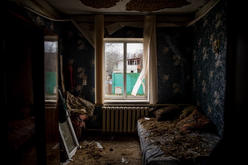 "Window 3". The window of a house affected by shells, taken on 16 April 2022, in Chernihiv, Ukraine. Looking out was never as dangerous as it is now. The war is felt both at home and on the streets, and windows are now glassless from the impact of missiles, bombs and gunfire. What was once a living room or a dining room is now a box from which people can see and hear the pain and desolation. In Ukraine, each window shows a horror story. These photographs were taken between March and April 2022. They reflect on how a home is now a space where devastation dwells and how its windows are now frames for the destruction outside. © Miguel Gutierrez, Venezuela, Shortlist, Professional competition, Architecture & Design, Sony World Photography Awards 2023