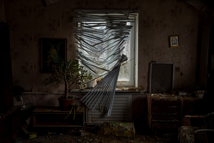 "Window 5". The window of a house affected by shells, taken on 16 April 2022, in Chernihiv, Ukraine. Looking out was never as dangerous as it is now. The war is felt both at home and on the streets, and windows are now glassless from the impact of missiles, bombs and gunfire. What was once a living room or a dining room is now a box from which people can see and hear the pain and desolation. In Ukraine, each window shows a horror story. These photographs were taken between March and April 2022. They reflect on how a home is now a space where devastation dwells and how its windows are now frames for the destruction outside. © Miguel Gutierrez, Venezuela, Shortlist, Professional competition, Architecture & Design, Sony World Photography Awards 2023
