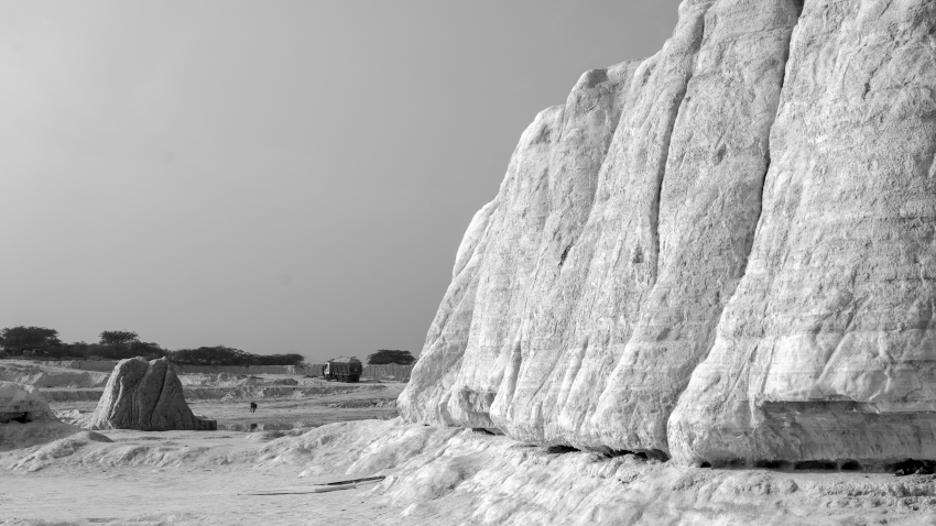 "Government Apathy". Faced with the challenge of disposing of the waste marble, Rajasthan State Industrial Development and Investment Corporation (RIICO) and the Kishangarh Marble Association initially decided to store it in one specific area. However, as the pile of waste grew, it took on the shape of the snowy hill, spread over more than 125 acres. During the second phase of this dumping, which was completed in 2009, the local marble association had around 200 tankers dumping the slurry non-stop. Kishangarh is situated in the Ajmer district of the Indian state of Rajasthan, 29 kilometres (18 miles) north west of Ajmer and 90 kilometres (55 miles) from Jaipur. Kishangarh’s economy depends primarily on marble trading, and the rock is used widely for its beauty in architecture and sculpture. However, marble slurry is a big problem. The by-product of processing and polishing marble, the slurry takes up a lot of space and is an environmental hazard, especially after it has dried. The poor air quality, caused by the dust, weakens people’s immune systems, while the minute dust particles lead to respiratory diseases, such as bronchitis, among the local population. In other countries this might prompt mine owners to close their sites in anticipation of legal action, but here the operators are taking a different, more enterprising course of action, and people from across India and beyond are actually travelling to visit the waste sites. © Haider Khan, India, Shortlist, Professional competition, Environment, Sony World Photography Awards 2023