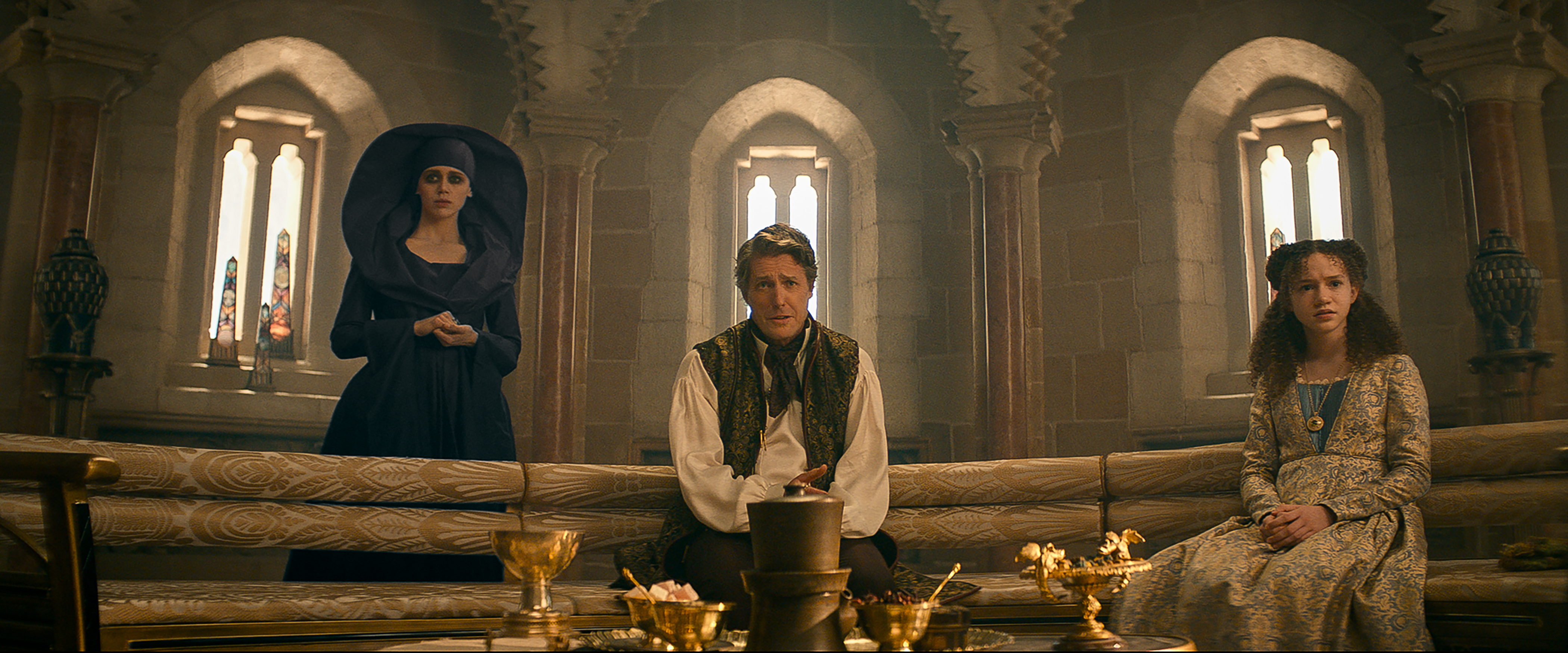 Daisy Head plays Sofina, Hugh Grant plays Forge and Chloe Coleman plays Kira in 'Dungeons & Dragons: Honor Among Thieves'. Image: Paramount Pictures / eOne / Supplied