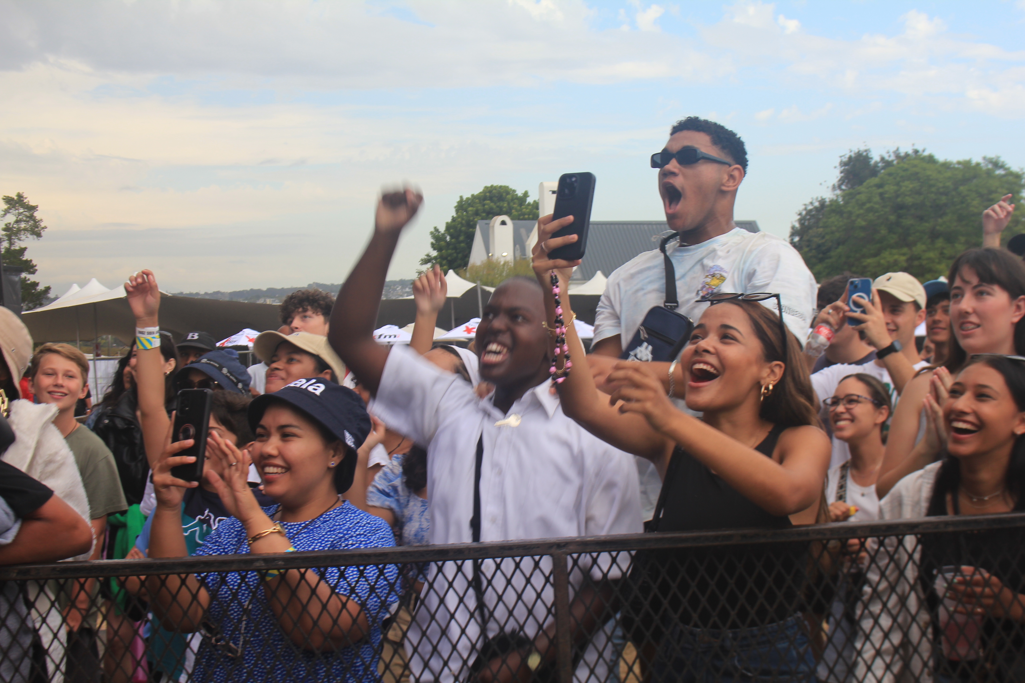 The fan who threw their phone to Anica Kiana (white shirt, centre) and friends celebrating the moment at the Galaxy KDay Festival. Image: An Wentzel