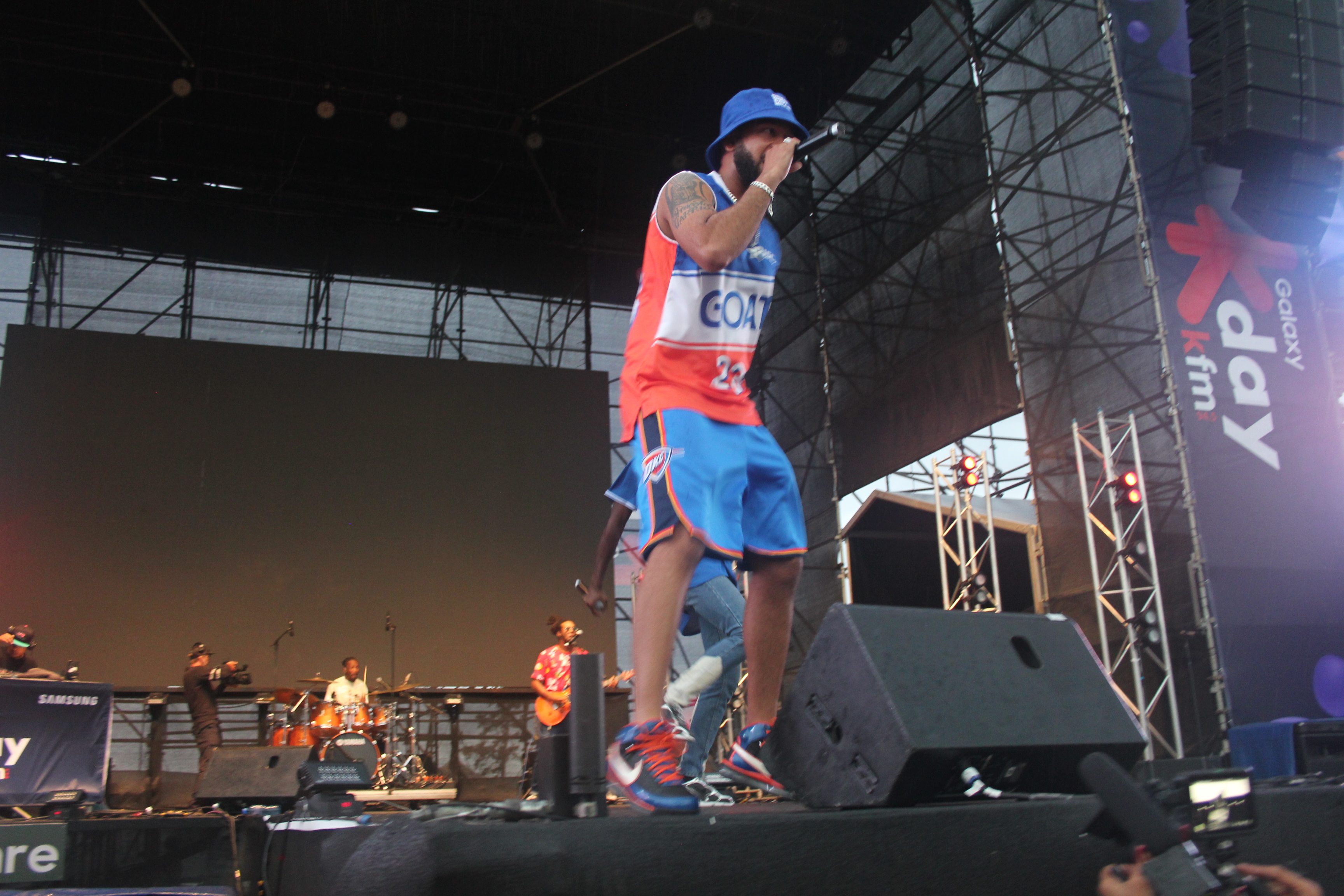 YoungstaCPT in action, refusing to let the rain stop the showat the Galaxy KDay Festival. Image: Oren-Andrew Wentzel