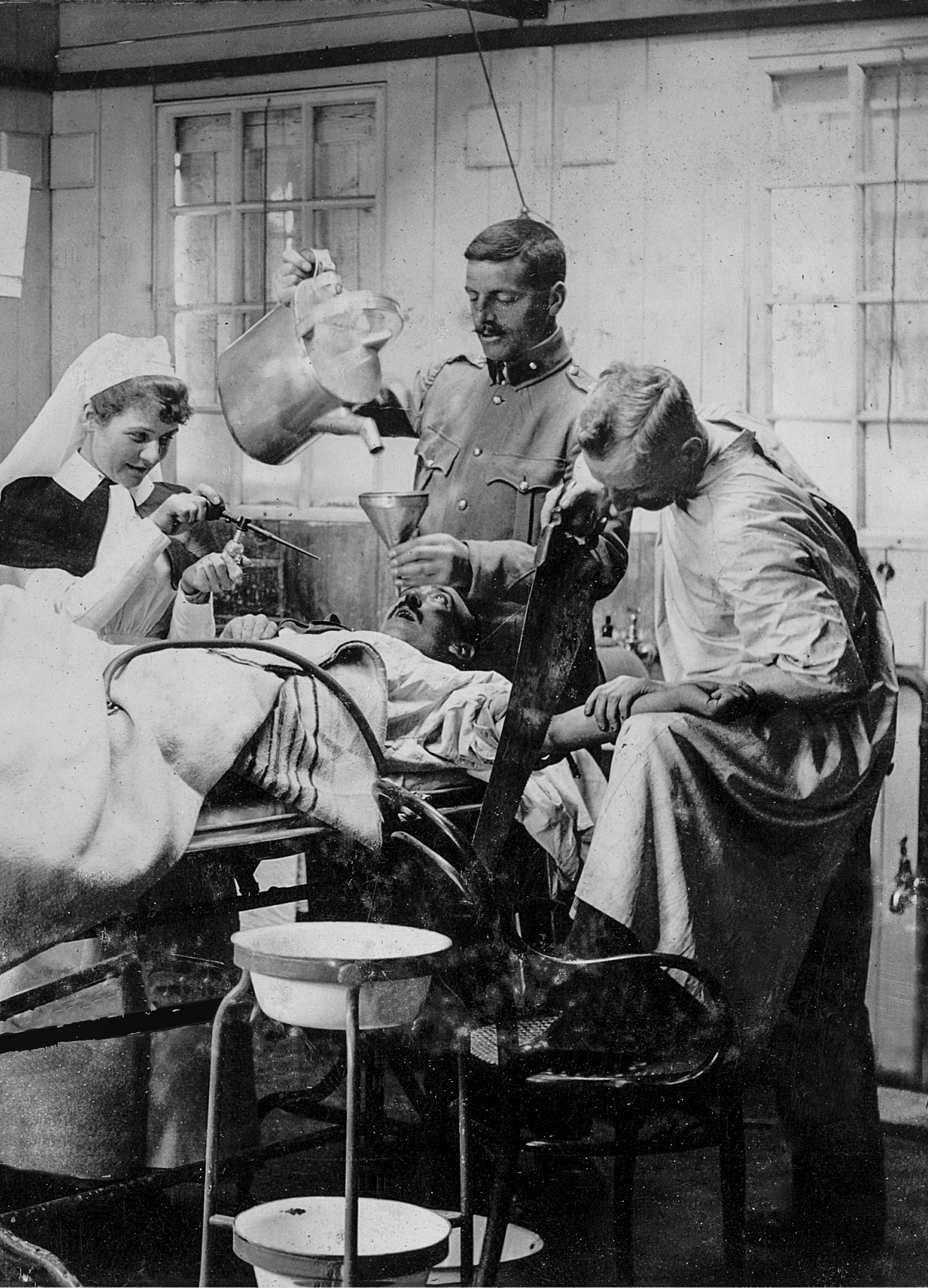 A posed photograph of an operation in progress at a hospital theatre in Deelfontein. (Courtesy Van Dyk ABO Trust Collection).