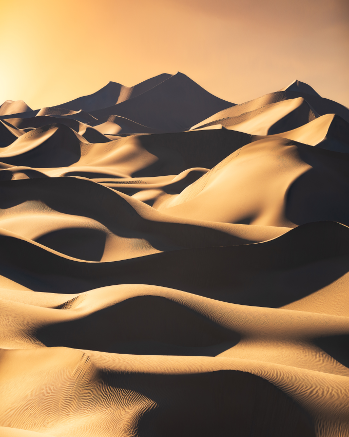 'Dunes'. Layers of spectacular sand dunes illuminated by the sun before it hides below the horizon in Death Valley National Park. © Marcin Zajac, Poland, Shortlist, Open Competition, Landscape, 2023 Sony World Photography Awards 