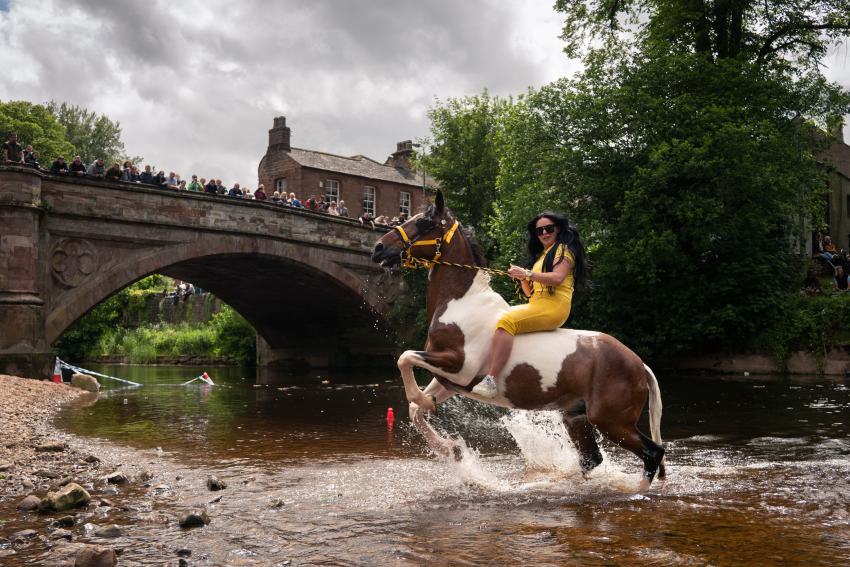 'The Queen of Appleby'. Martina and her horse Apache are one of the most familiar sights at Appleby Horse Fair. The event in northern England is one of the largest annual gatherings of Travellers in Europe. Horses are ridden and washed in the river, which is quite a spectacle. © Ruth Chamberlain, United Kingdom, Shortlist, Open Competition, Lifestyle, 2023 Sony World Photography Awards
