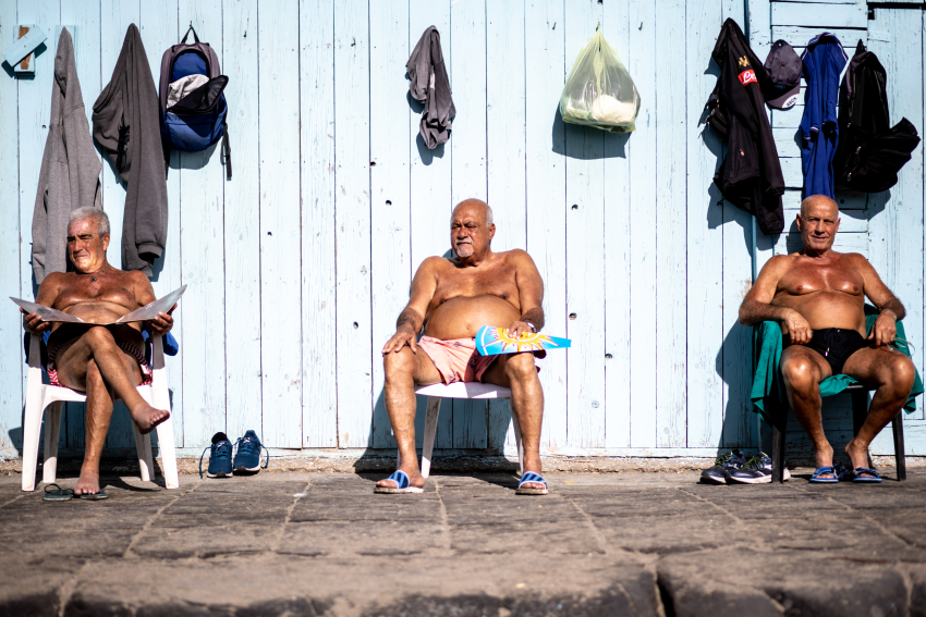 'Sunbathing in February'. Three men preparing for summer in Naples, Italy. © Raffaella De Luise, Italy, Shortlist, Open Competition, Lifestyle, 2023 Sony World Photography Awards 