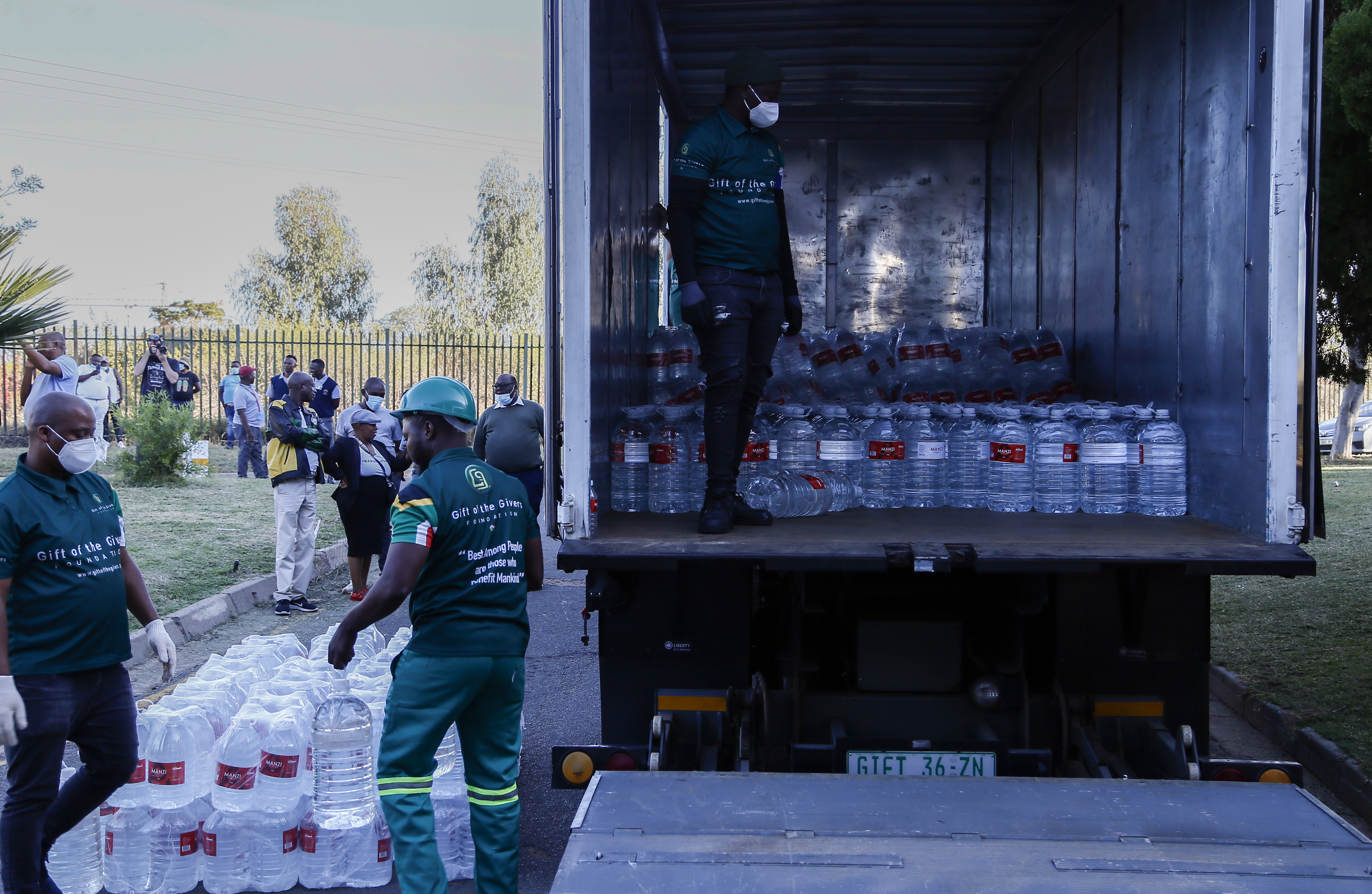 Gift of the Givers aid workers offload water from a truck at Jubilee District Hospital in Hammanskraal where the cholera death toll has risen to 15