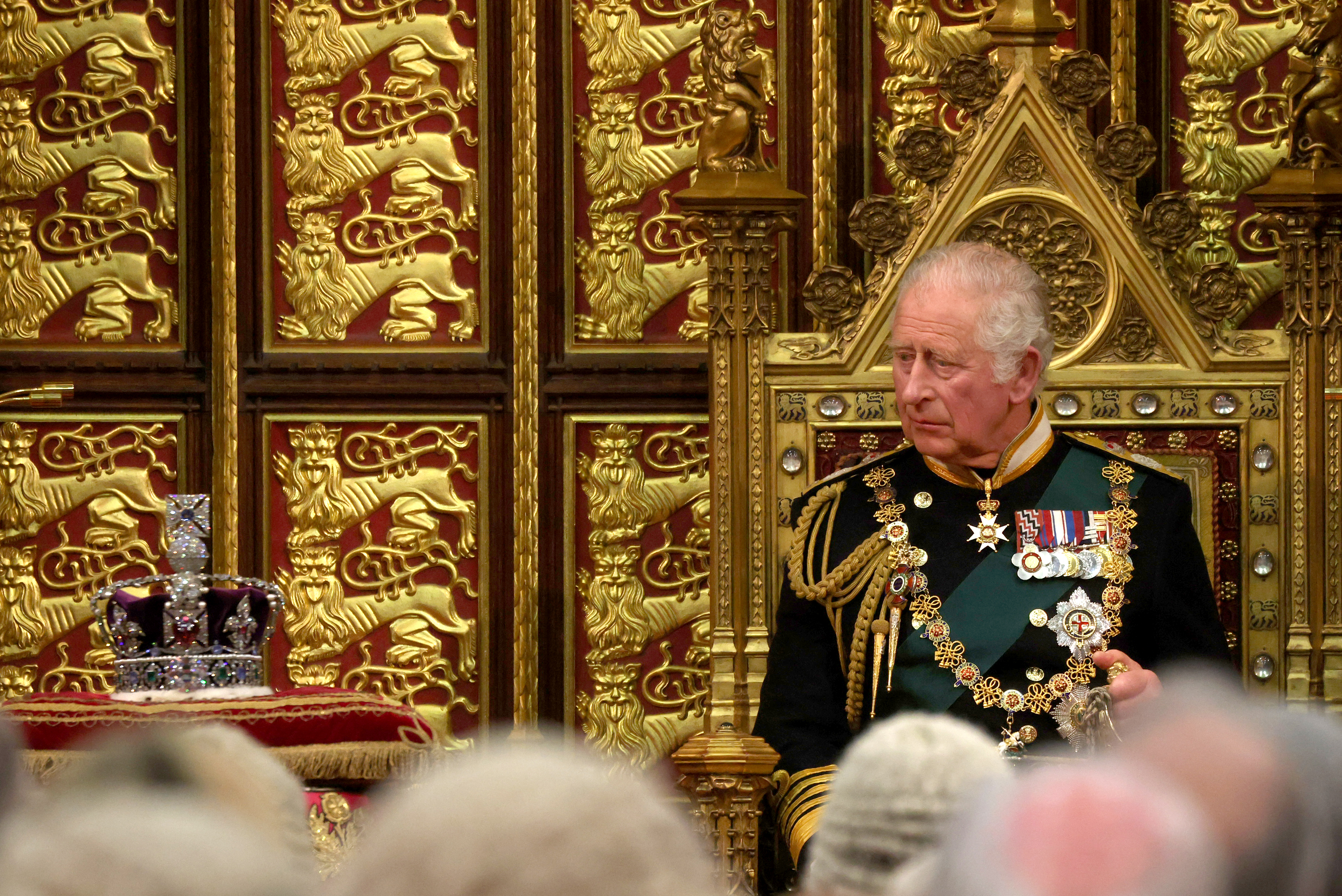 Prince Charles, now the king, reads the Queen’s speech as he sits by the Imperial State Crown in the British Parliament in May 2022. (Photo by Dan Kitwood/Getty Images)