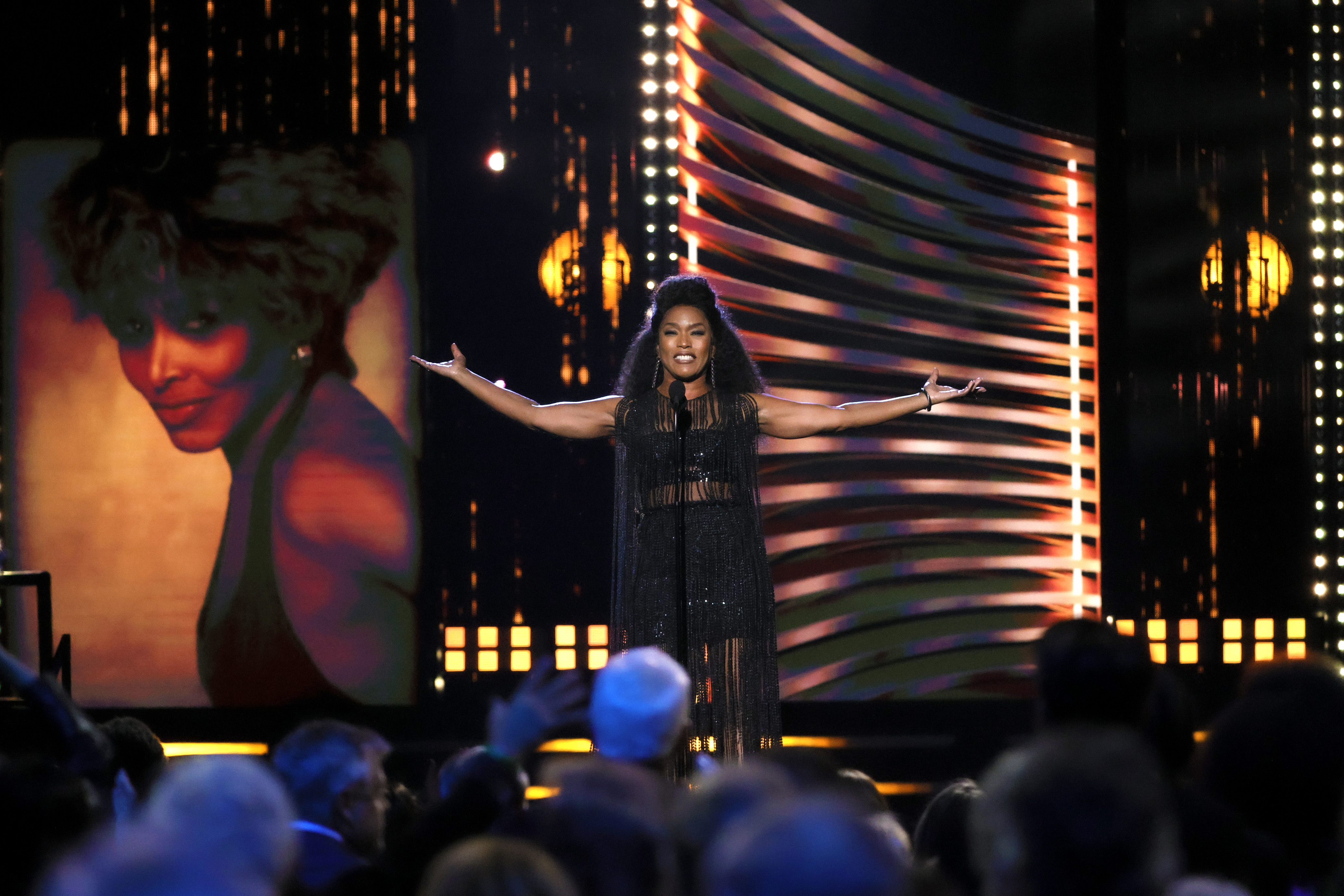 Angela Bassett inducts Tina Turner onstage during the 36th Annual Rock & Roll Hall Of Fame Induction Ceremony at Rocket Mortgage Fieldhouse on October 30, 2021 in Cleveland, Ohio. (Photo by Michael Loccisano/Getty Images for The Rock and Roll Hall of Fame)
