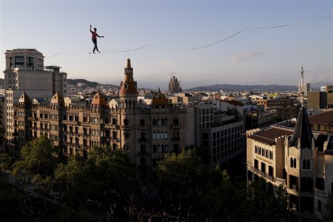 Tightrope walker walks a 350-meters cable in Barcelona, and more from around the world