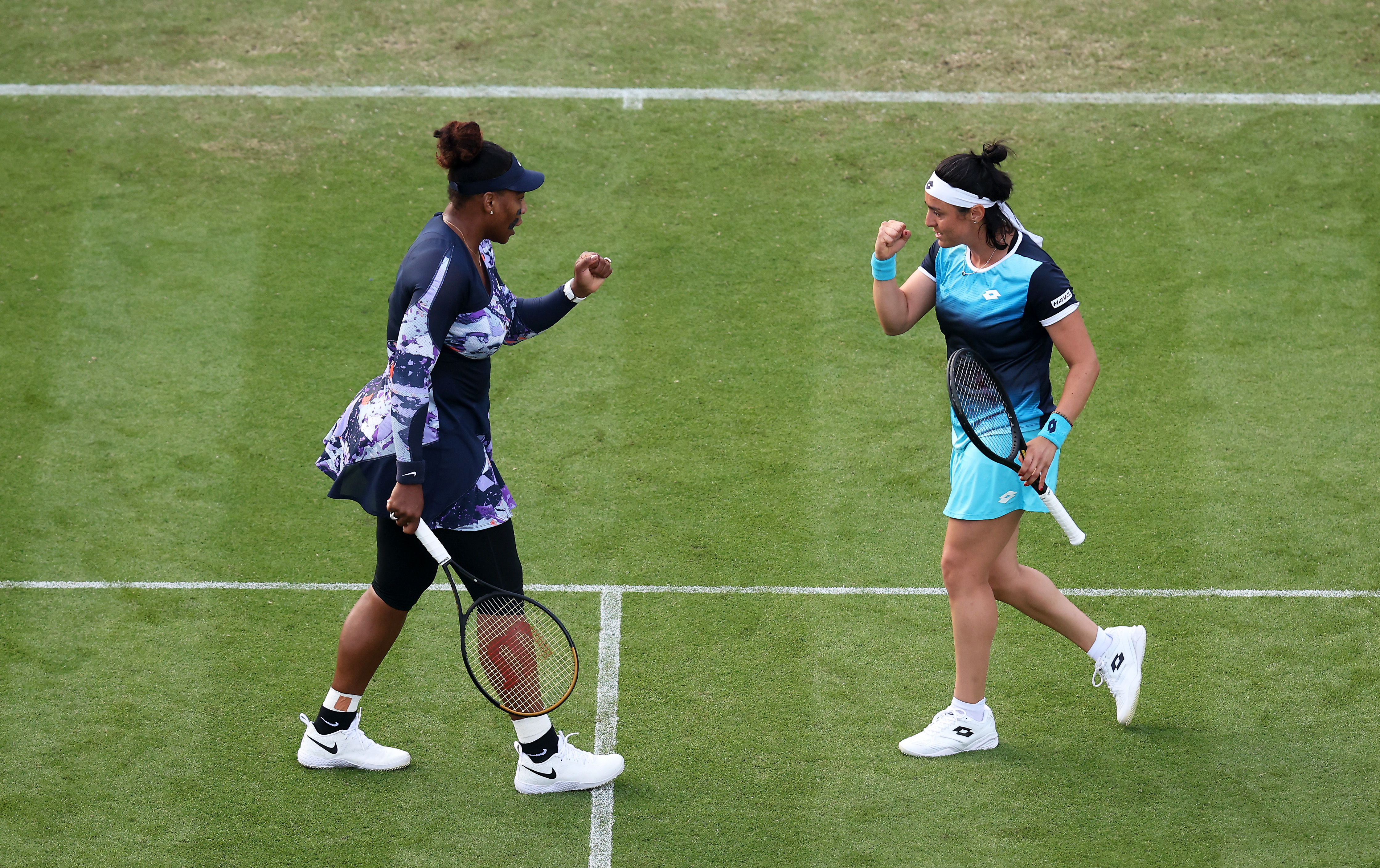 Serena Williams of USA interacts with Ons Jabeur of Tunisia during their Doubles match against Sara Sorribes Tormo of Spain and Marie Bouzková of Czech Republic during Day Four of the Rothesay International Eastbourne at Devonshire Park on June 21, 2022 in Eastbourne, England. (Photo by Charlie Crowhurst/Getty Images for LTA)