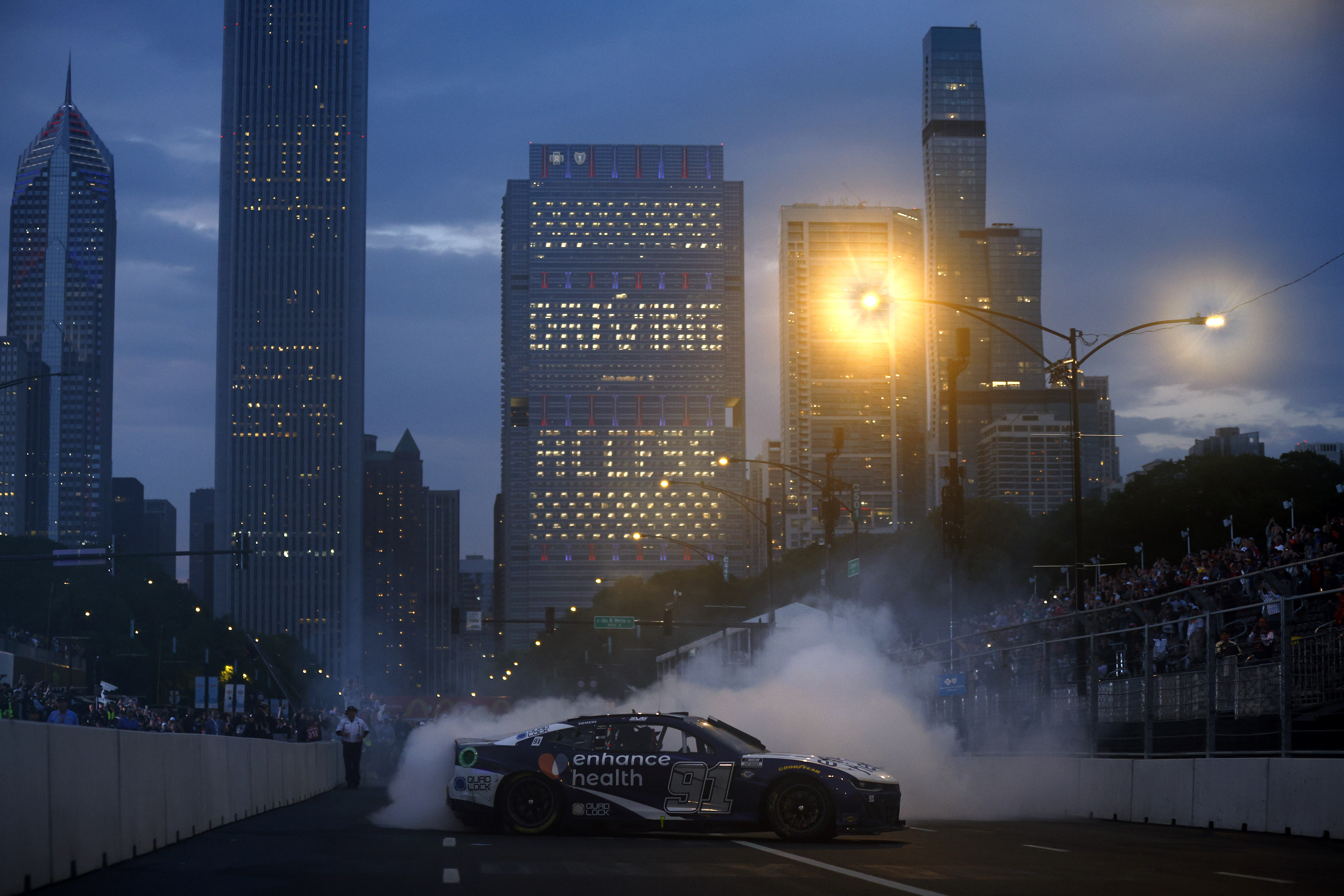 Shane Van Gisbergen, driver of the #91 Enhance Health Chevrolet, celebrates with a burnout after winning the NASCAR Cup Series Grant Park 220 at the Chicago Street Course on July 02, 2023 in Chicago, Illinois. (Photo by Jared C. Tilton/Getty Images)