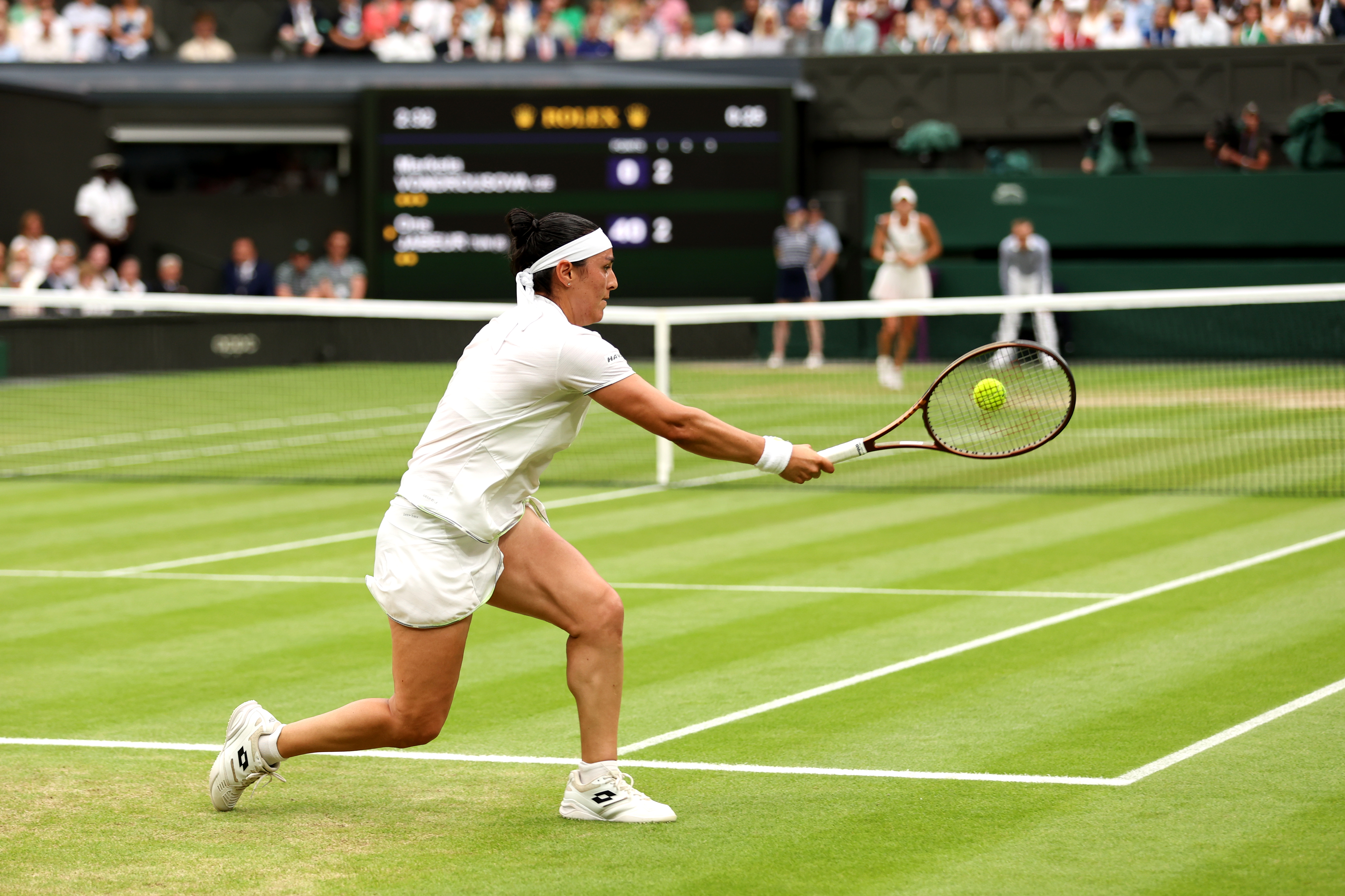 Ons Jabeur of Tunisia plays a forehand during the Women's Singles Final against Marketa Vondrousova of Czech Republic on day thirteen of The Championships Wimbledon 2023 at All England Lawn Tennis and Croquet Club on July 15, 2023 in London, England. (Photo by Julian Finney/Getty Images)
