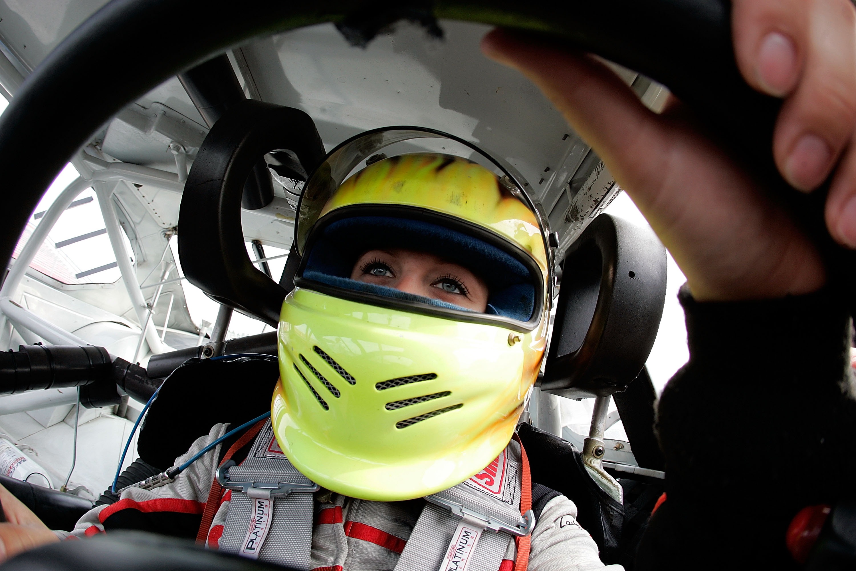 SOUTH BOSTON, VA - OCTOBER 16: Driver Jessica Helberg climbs behind the wheel durig the NASCAR Drive for Diversity combine at South Boston Speedway October 16, 2007 in South Boston, Virginia. (Photo by Grant Halverson/Getty Images for NASCAR)