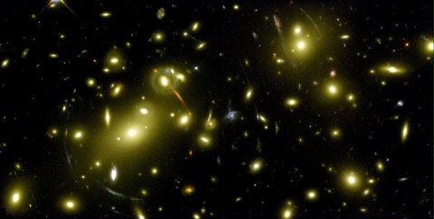 Looking back toward cosmic dawn − astronomers confirm the faintest galaxy ever seen
