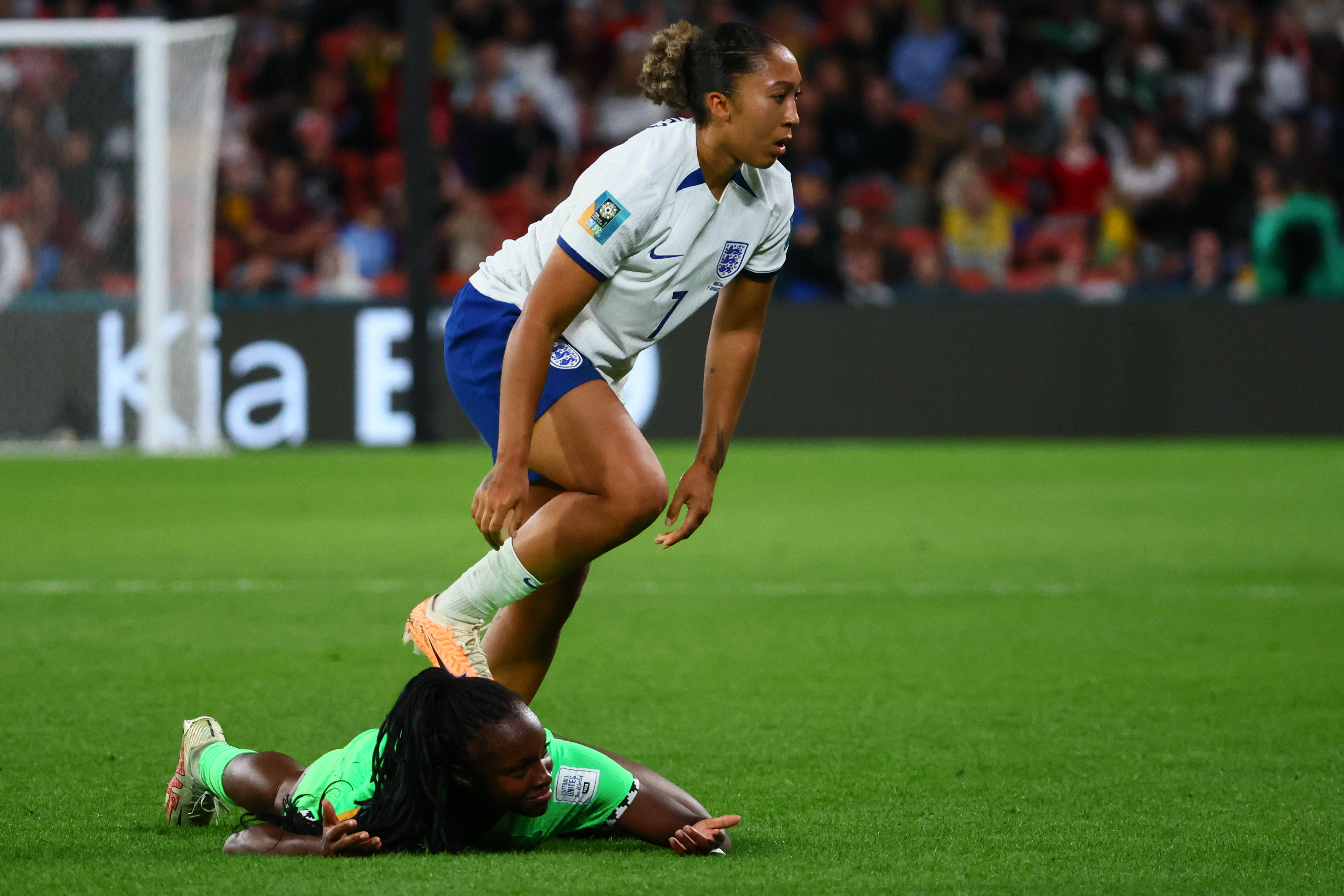 Michelle Alozie is fouled by by England's Lauren James