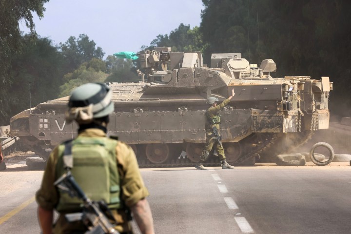 Israel calls for civilians to leave Gaza City as military amasses tanks