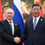 Putin Visits Xi as US Threatens China Sanctions Over Ties
