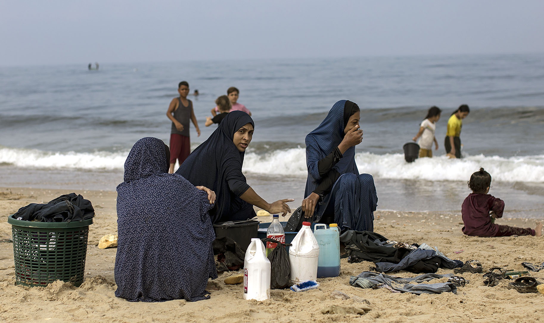 Palestinians gathering sea water