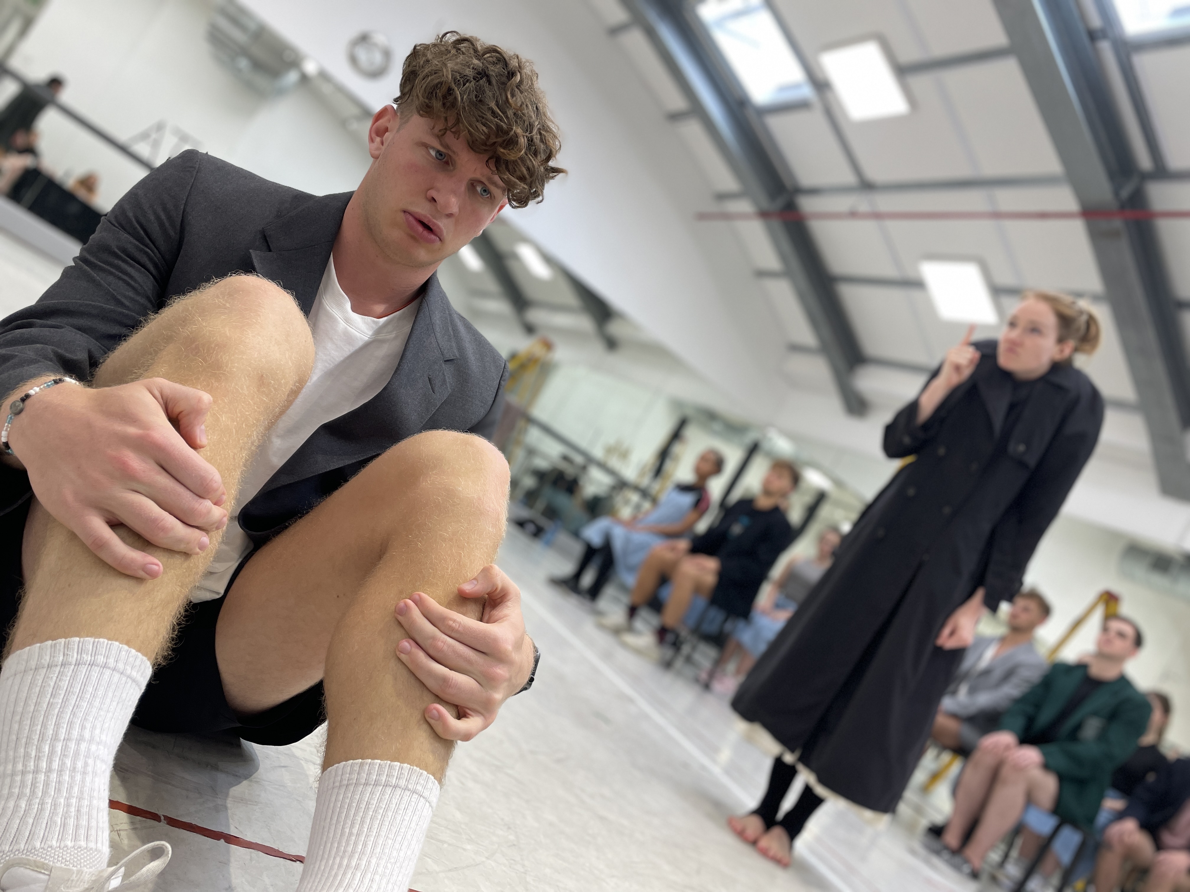 In a rehearsal of 'Spring Awakening', Dylan Janse van Rensburg as Melchior, with one of the ominous and school teachers looming. Image: Duane Alexander