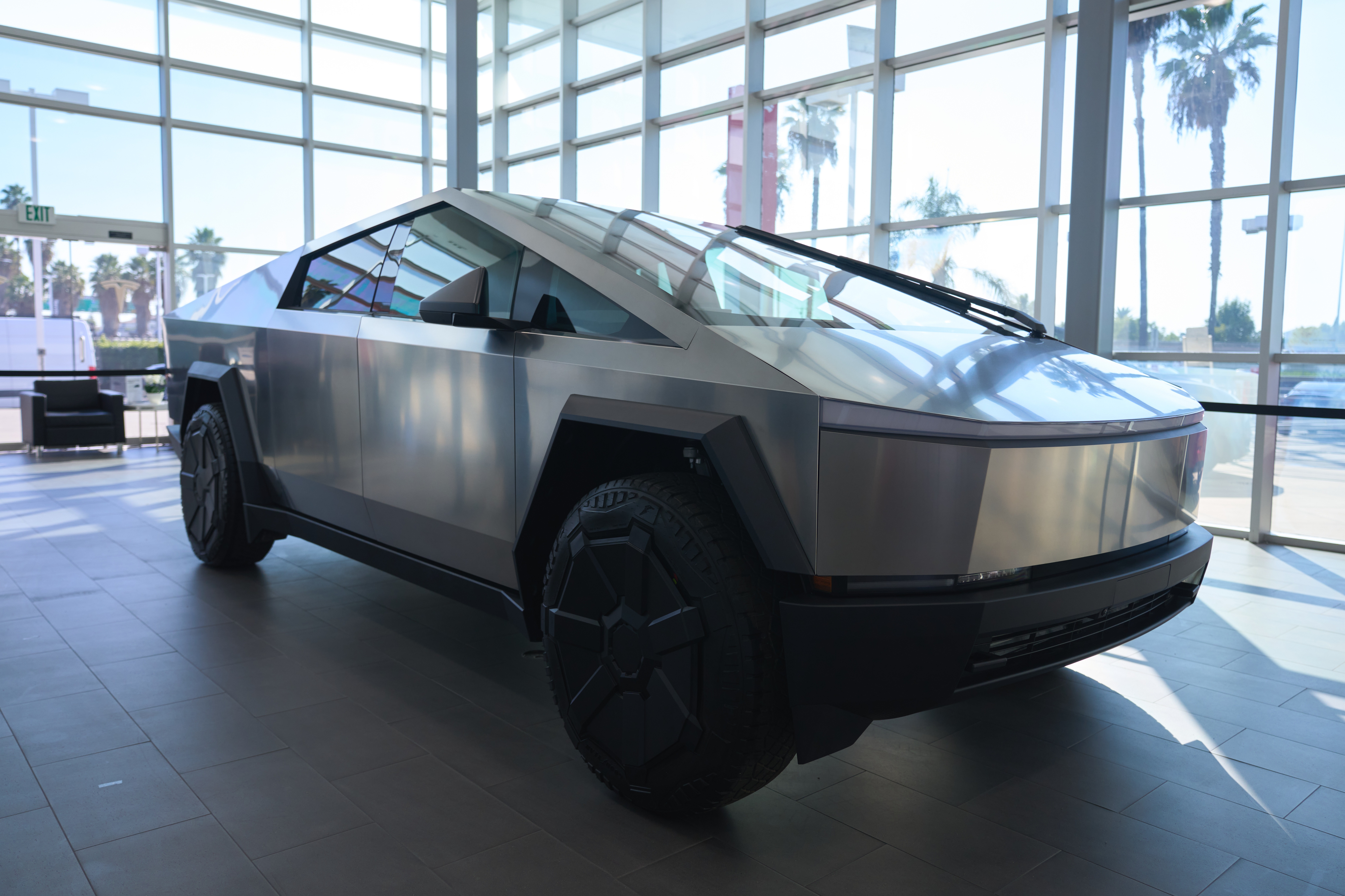A Tesla Cybertruck is on display at Tesla in Buena Park, California, USA, 01 December 2023. After four years of delays and complications, the Tesla Cybertruck was released on 01 December by Tesla CEO Elon Musk. The cheapest rear-wheel drive model won't be available until 2025 at the earliest, with a price starting at 60,990 US dollars. EPA-EFE/ALLISON DINNER
