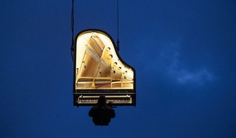 Pianist plays concert while hanging from a crane, and more from around the world