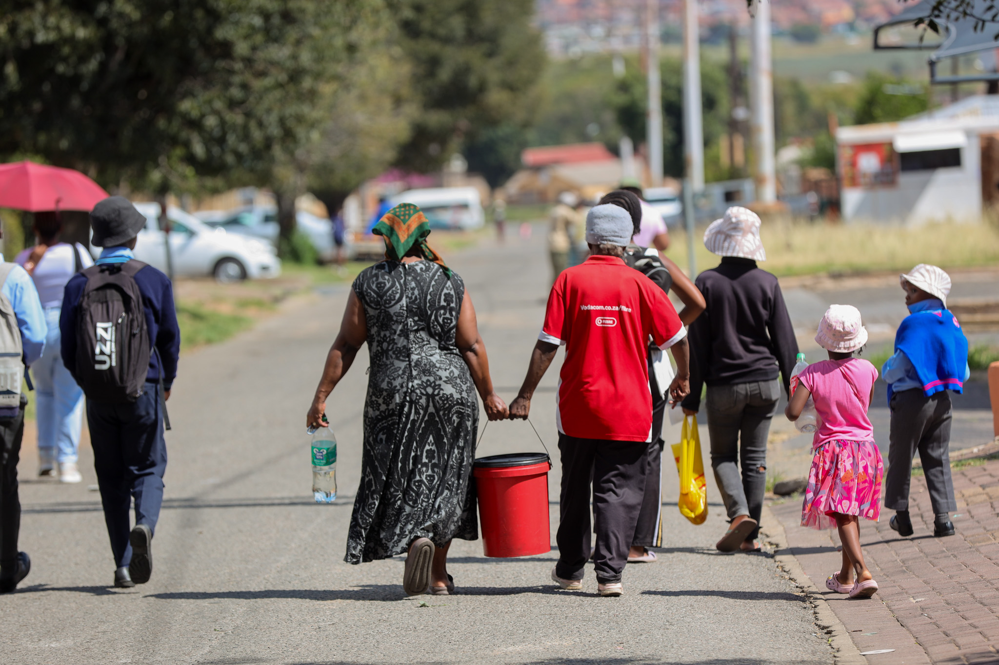 Residents of Dube and Meadowlands fetching water in on March 15, 2024 in Soweto, South Africa. It is reported that the water crisis is due to faults and power outages at several pumping stations, and has affected several areas in the south of Joburg and in others such as Bryanston and Kensington. (Photo by Gallo Images/Fani Mahuntsi)