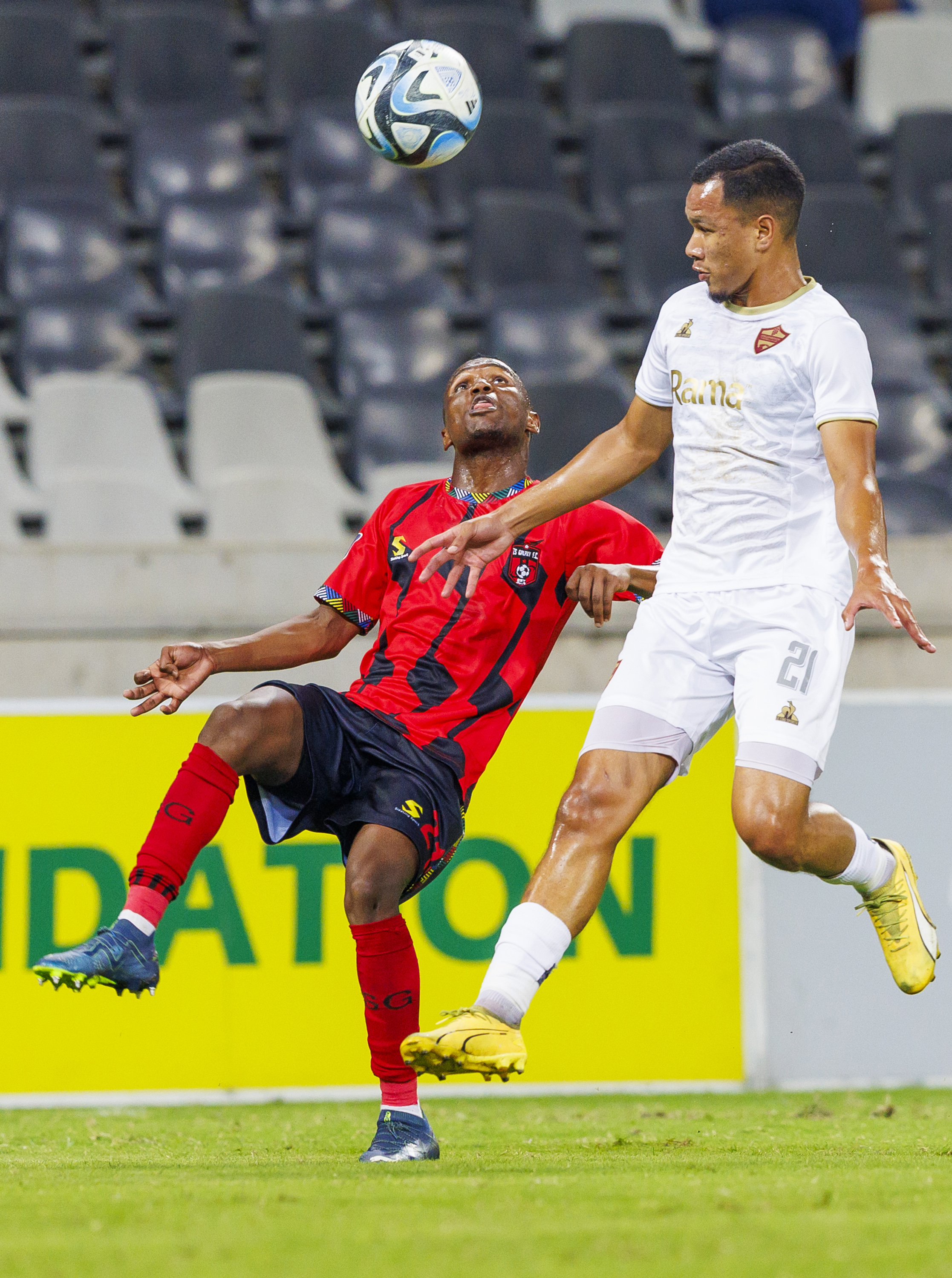 Kamogelo Sebelebele of TS Galaxy FC and Fawaaz Basadien of Stellenbosch FC