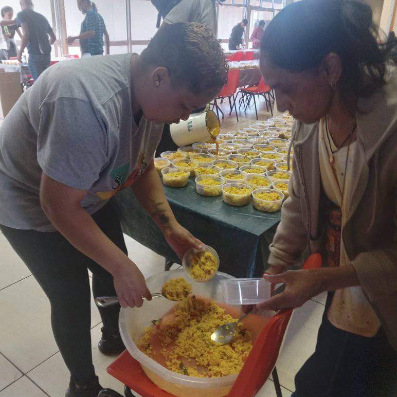 Sharlene Abels and her colleague dish up rice for their daily feeding scheme that provides a lifeline for about 200 people from Eldorado Park and neighboring communities 