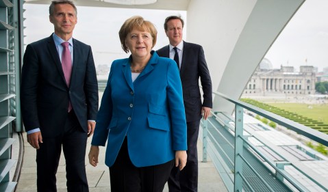 Merkel says EU ready to act as Spain downgraded
