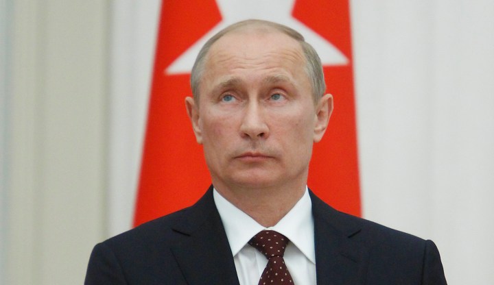 Putin urges Syria talks, signals no shift