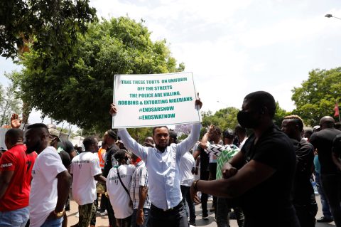 Angry Nigerians living in South Africa march against their country’s government failures