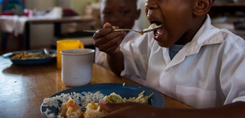 School feeding court case: The justice of eating and the obscenity of hunger