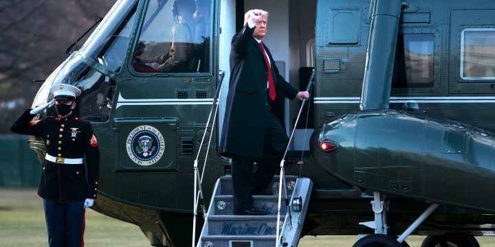 Trump says goodbye at airbase send-off, leaves a note for Biden