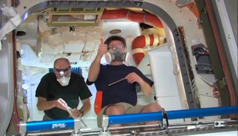 Astronauts float inside SpaceX Dragon capsule